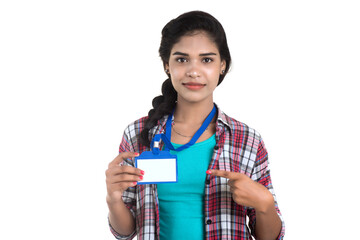 Sticker - Young woman holding Identification white blank plastic id card.