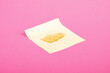 pieces high THC wax on pink background, marijuana smoking concentrate