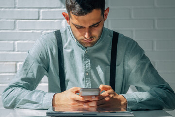 business man looking at mobile phone