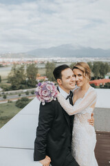 Canvas Print - Newly-married bride and the groom posing for their wedding photoshoot