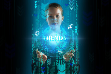 Business, Technology, Internet and network concept. Young businessman working on a virtual screen of the future and sees the inscription: Trends