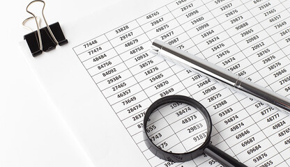 Poster - Pen and magnifier on paper chart on the white background