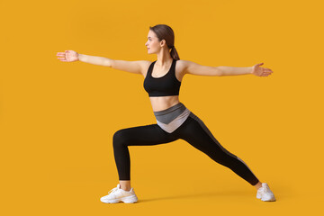 Poster - Sporty young woman doing yoga on color background