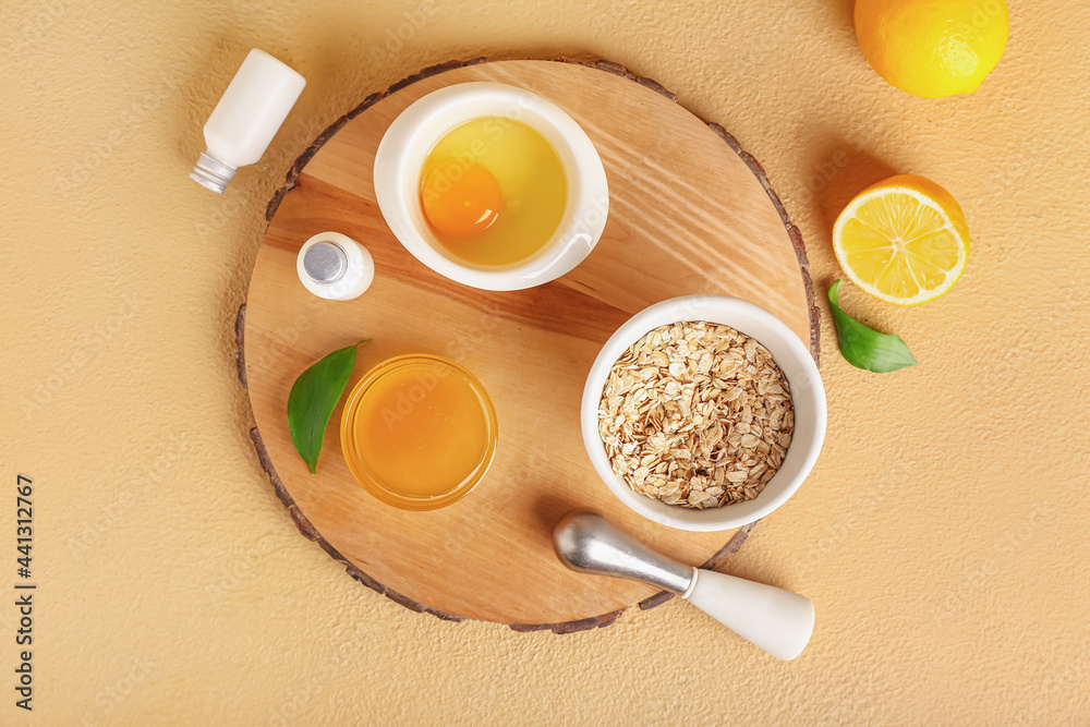 Natural ingredients for homemade cosmetics on color background