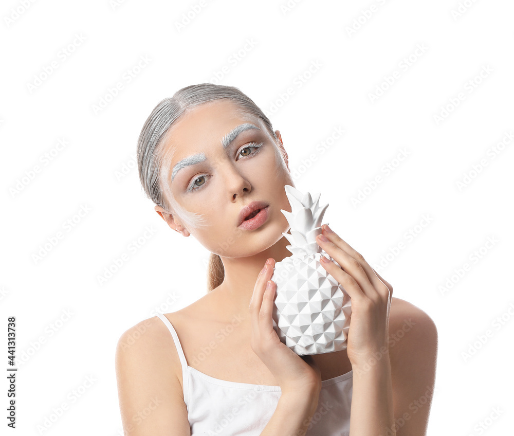 Beautiful young woman with dyed eyebrows and decor on white background