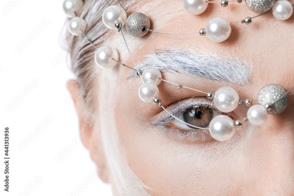 Beautiful young woman with dyed eyebrows and stylish accessory on white background