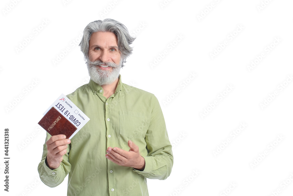 Senior man with passport and negative covid-19 test result on white background