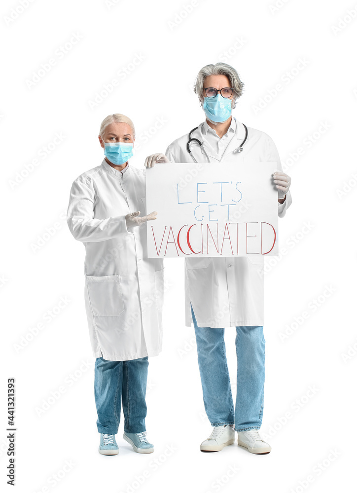 Doctors holding poster with text LET'S GET VACCINATED on white background