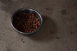 Cat food or dog foo.d in a container on cement. セメントの上の容器に入ったキャットフード又はドックフード。