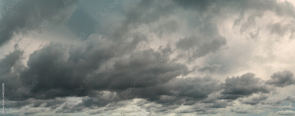 Panorama view of overcast sky. Dramatic gray sky and white clouds before rain in rainy season. Cloudy and moody sky. Storm sky. Cloudscape. Gloomy and moody background. Overcast clouds. - obrazy, fototapety, plakaty 