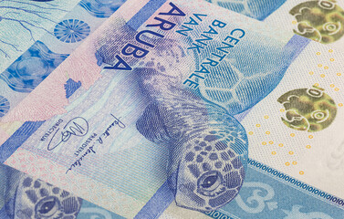 Close up to Florin, banknotes of the island country Aruba. Detailed capture of the front art design. Detailed money background wallpaper. Currency banknotes of the Netherland Caribbean island 