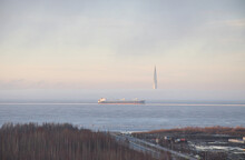 Large Cargo Ship In The Gulf Of Finland. Winter. Skyscraper Lakhta Center In Background. Fog, Beautiful Landscape. Baltic Pearl, St. Petersburg. High Quality Photo