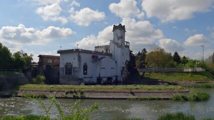 Sticker - A scenic view of the hydraulic power plant through Bega river at Timisoara, Romani in 4K