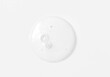 Clear transparent circle spot with bubbles cosmetic product texture isolated on white background. Facial serum smear, shower gel smudge, shampoo, essence swatch