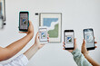 © Seventyfour - Background image of hands holding smartphones in modern art gallery and taking photos of paintings, digital world, copy space