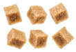 Brown sugar cubes on white background. Macro picture.