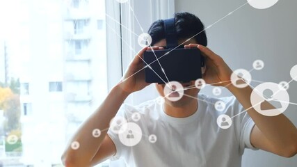 Poster - Animation of network of connections with icons over man wearing vr headset