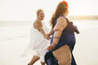 © DisobeyArt - Plus size women walking on the beach having fun during summer vacation - Focus on right girl