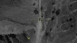 Fototapeta  - Aerial view of a military drone takes aim at a tank and shoots at it