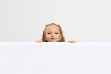 portrait of nice beautiful little girl in casual clothes isolated on white studio background. happy 