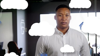 Poster - Animation of network of digital icons and clouds over businessman in office