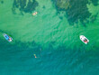 © Austockphoto - Looking day on boats anchored on a calm blue ocean