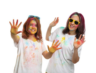 Wall Mural - Woman and teen girl covered with colorful powder dyes on white background. Holi festival celebration