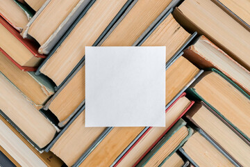 A pattern of old books with a top view. Solid background with copy space. The concept of waste paper and paper recycling.