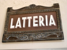 An Italian Dairy Sign On The Side Of A Building