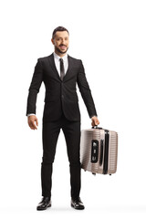 Wall Mural - Full length portrait of a man in a suit and tie carrying a suitcase and looking at camera