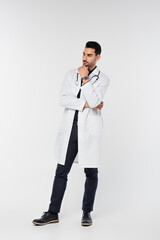 Poster - Full length of muslim doctor looking away on grey background