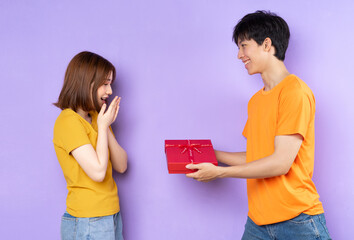 Asian couple portrait, isolated on purple background