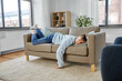 © Syda Productions - people, boredom and depression concept - bored or lazy young man lying on sofa at home