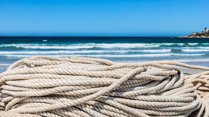 traditional fishing net on small rowing boat on beach
