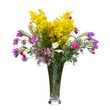 Bouquet of wild flowers in a glass vase isolated on white