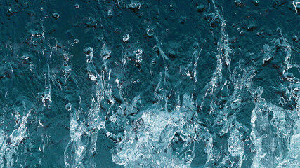 Abstract water splashes isolated on blue background