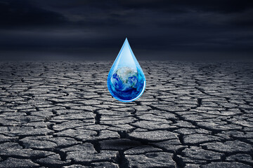 Wall Mural - Ecology and Environmental Concept : Blue planet earth in water drop with cracked brown ground in background. (Elements of this image furnished by NASA.)