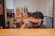 © ADDICTIVE STOCK - Asian lady during lunch in modern cafe