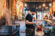© ADDICTIVE STOCK - Man in bandana standing at counter and cooking ramen