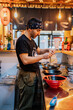 © ADDICTIVE STOCK - Professional man preparing dish in cafe