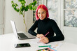 © ADDICTIVE STOCK - Pensive fashion designer working at home