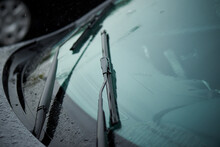 Car windshield wiper in the rain.