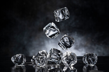 Wall Mural - ice cubes on black background