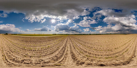 Wall Mural - full seamless spherical hdri panorama 360 degrees angle view among farm fields in spring day awesome clouds in equirectangular projection, ready for VR AR virtual reality content