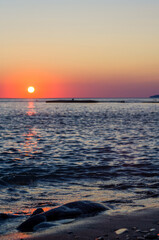 Wall Mural - Amazing sea sunset, the sun, waves, clouds