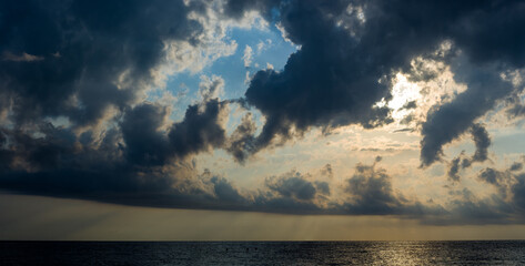 Wall Mural - Amazing sea sunset, the sun, waves, clouds