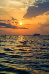 Wall Mural - Amazing sea sunset, the sun, waves, clouds
