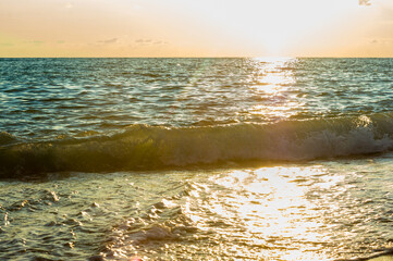 Wall Mural - Amazing sea sunset, the sun, waves, clouds