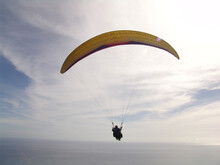 Person Paragliding Over The Caribbean Sea