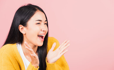 Wall Mural - Happy Asian portrait beautiful cute young woman standing surprised excited screaming open mouth show hand studio shot isolated on pink background, Thai female smile winner successful with copy space